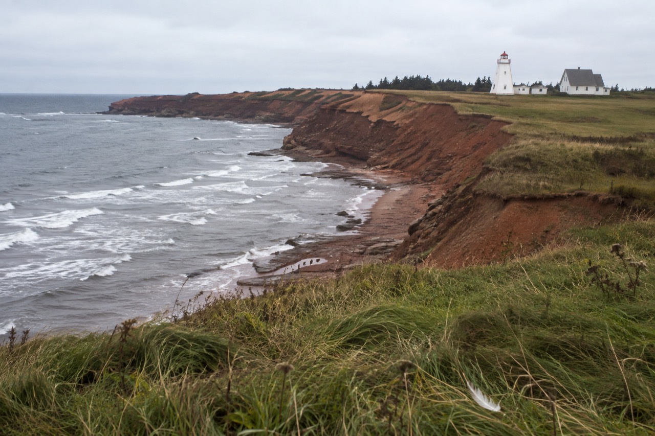 Red sandstone cliffs and green rolling fields along the Prince Edward Island coast