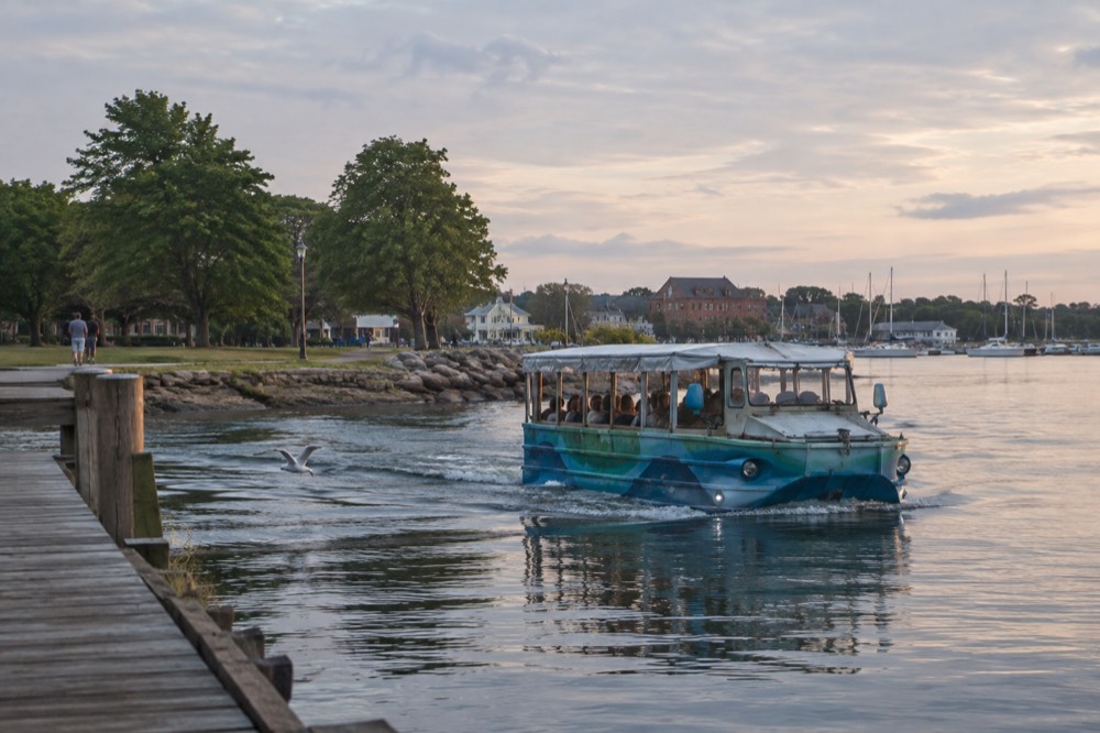 Amphibious tour vehicle floating in Charlottetown harbour beside the boardwalk