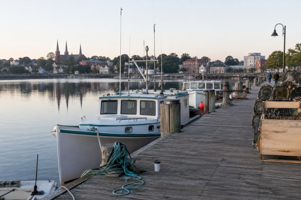 Waterfront boardwalk and moored boats at Peake's Wharf in Charlottetown