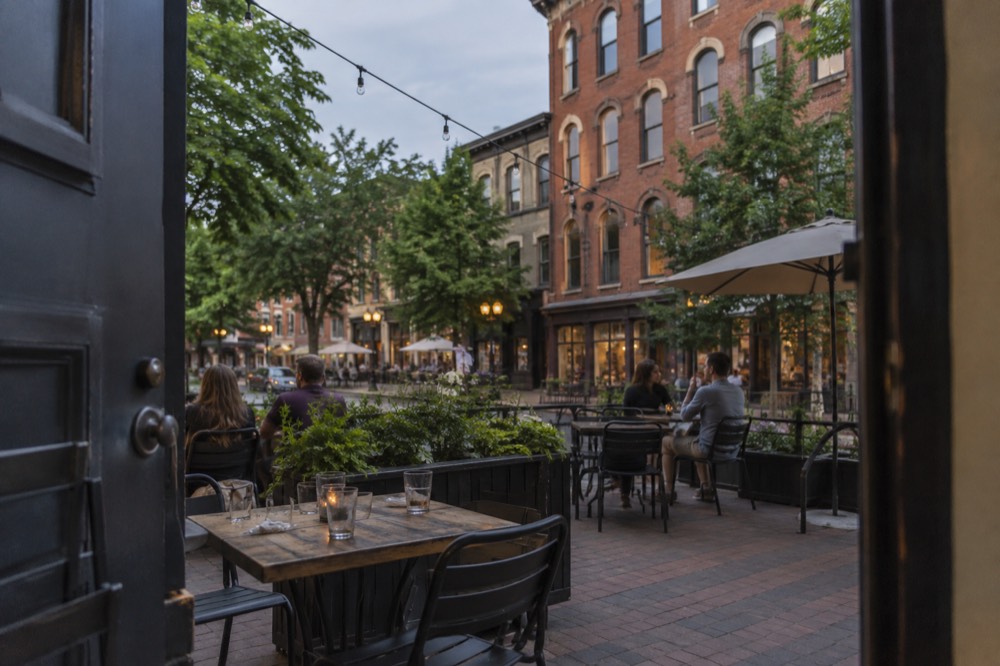 Historic brick storefronts and a pedestrian street with patios in downtown Charlottetown