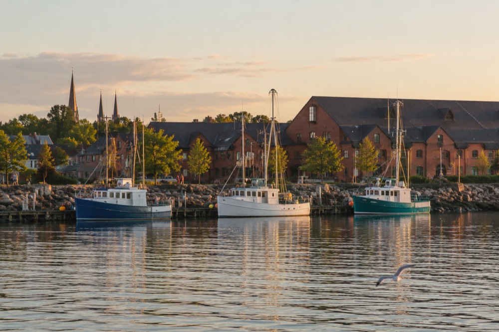 Harbour waterfront with boats and stone buildings in Charlottetown