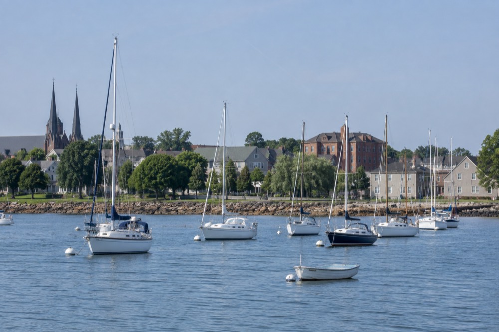 Waterfront boardwalk with sailboats moored in Charlottetown harbour