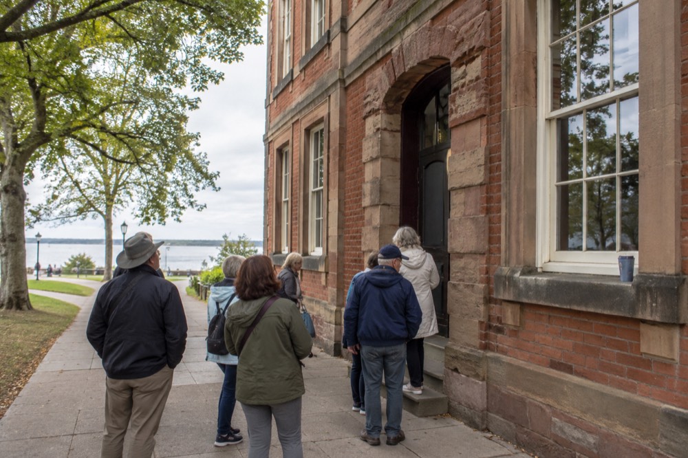 Victorian brick storefronts and tree-lined street in downtown Charlottetown